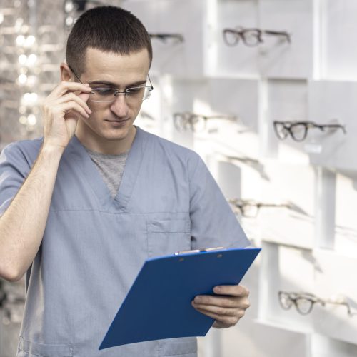 front-view-man-wearing-glasses-looking-notepad